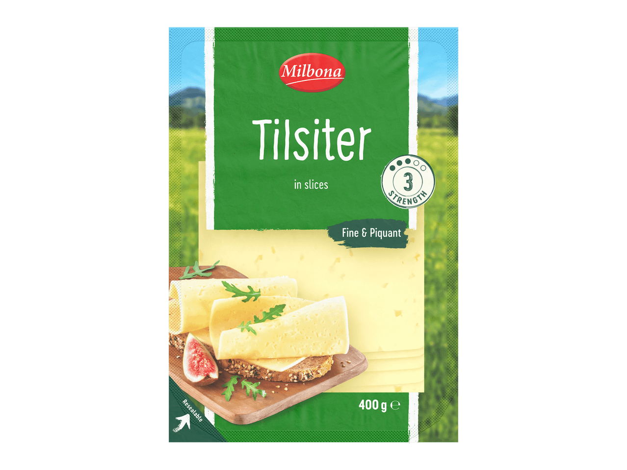Pakkaus viipaloitua Tilsiter-juustoa, jossa on leipää, viikunaa ja rucolaa.