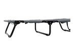 Grey camping cot with black metal frame, partially visible from a low angle.