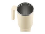 Cream-colored travel mug with a handle and a stainless steel interior, viewed from above.