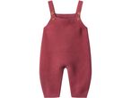 Knitted baby romper in a deep red color with wooden buttons on the straps