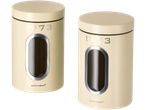 Two cream-colored storage containers with a clear window and '1973' printed on them.