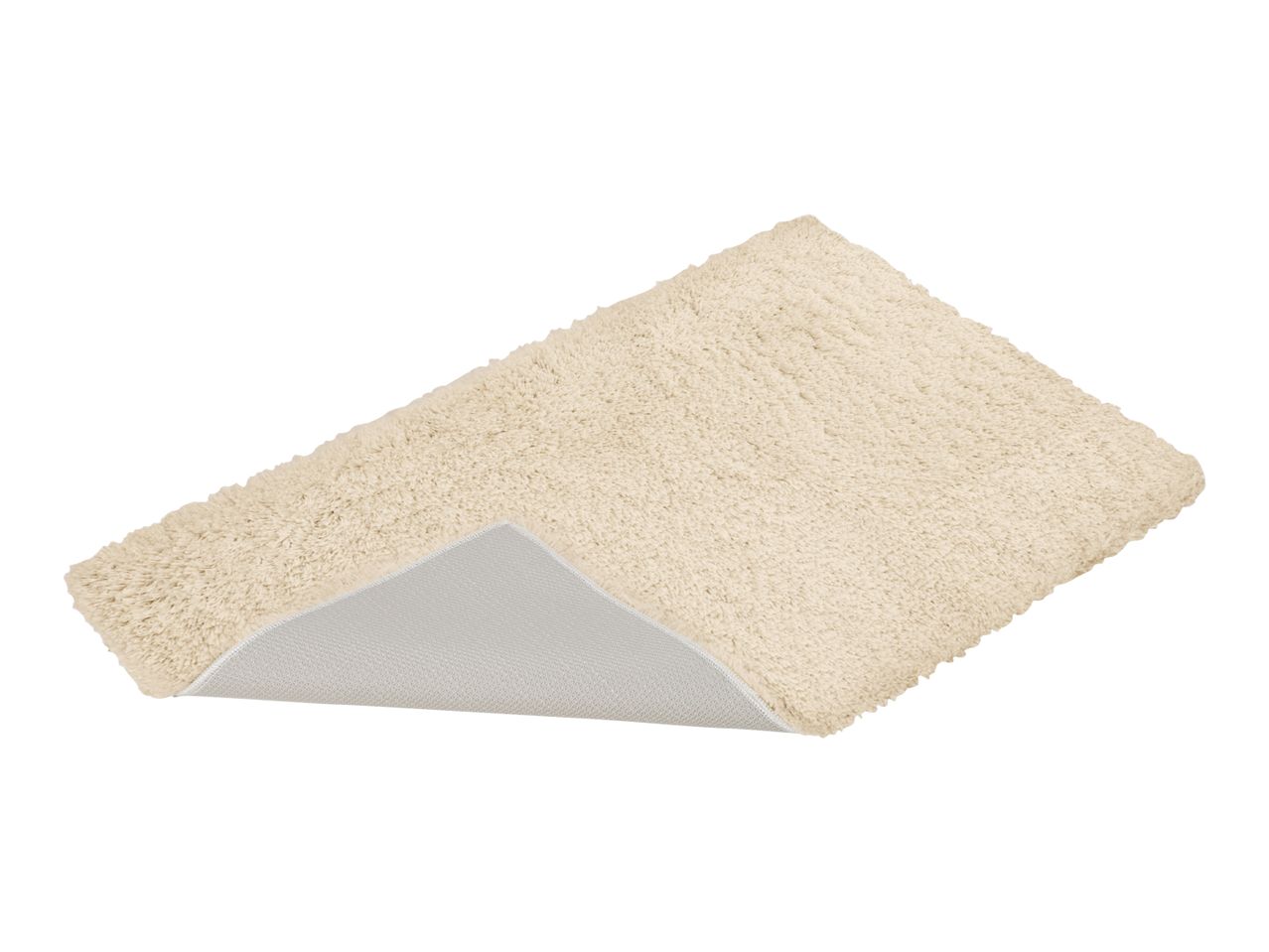 Cream-colored bath mat with a non-slip backing, angled view.