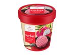 Japanese style dragon fruit sorbet in a red tub with a scoop of sorbet and dragon fruit.