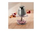 SilverCrest food chopper with chopped red onions on a wooden kitchen counter.