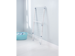 A white drying rack and a blue laundry basket in a room.
