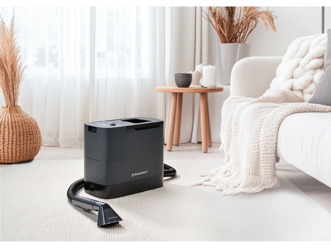 SILVERCREST® 20V Cordless Spot Cleaner on a rug in a bright living room.