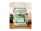 A mint green SilverCrest espresso machine with a temperature gauge on a wooden counter.