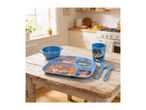 Blue children's dining set with cartoon dog characters, including a plate, bowl, cup, spoon, and fork, on a wooden table.