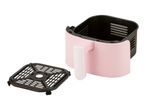 Pink air fryer basket with a black crisper plate beside it.