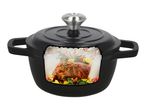 Black cast iron pot with a cut-out showing a roasted rack of lamb with herbs and vegetables.