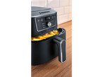 Black air fryer with a digital display showing 170 degrees Celsius, filled with golden fries.