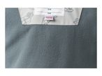 Close-up of a fleece garment with a white label featuring car illustrations and a 'KEEP AWAY FROM FIRE' warning.