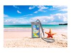 Waterproof phone pouch with a smartphone on a sandy beach with a starfish.