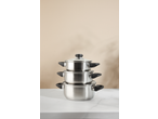 Conjunto de três panelas de aço inoxidável Silvercrest Mini-riskoger, empilhadas.