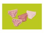 Four pairs of women's briefs in pink and striped patterns on a green background.