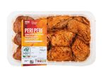 Peri Peri chicken oyster thighs and drumsticks in a clear tray, 750g, with a summer barbecue theme.