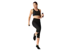 Woman in CRIVIT cropped sports leggings and top, holding dumbbells, exercising.
