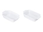 Two white rectangular ceramic baking dishes with ribbed sides and small handles.
