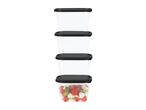 Stack of four clear rectangular food containers with black lids, one filled with salad.