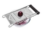 Mandoline slicer with a red onion being sliced into a glass bowl