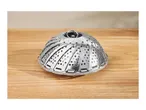 Stainless steel vegetable steamer basket on a wooden surface.