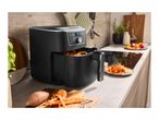 Silvercrest air fryer with sweet potato fries in a modern kitchen setting.