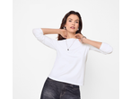 Woman wearing a white esmara® long sleeve top and dark jeans, posing with hands behind her neck.