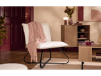 LIVARNO home chair with a pink throw in a living room setting.