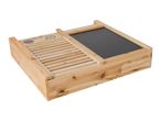 Wooden sandbox with a slatted side and a chalkboard lid, angled view.