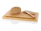 Sesame bread, bamboo bread board, and knife.