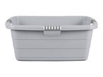 A gray plastic laundry basket with handles.