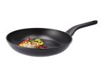 A black frying pan with a cooked fish fillet and vegetables inside.
