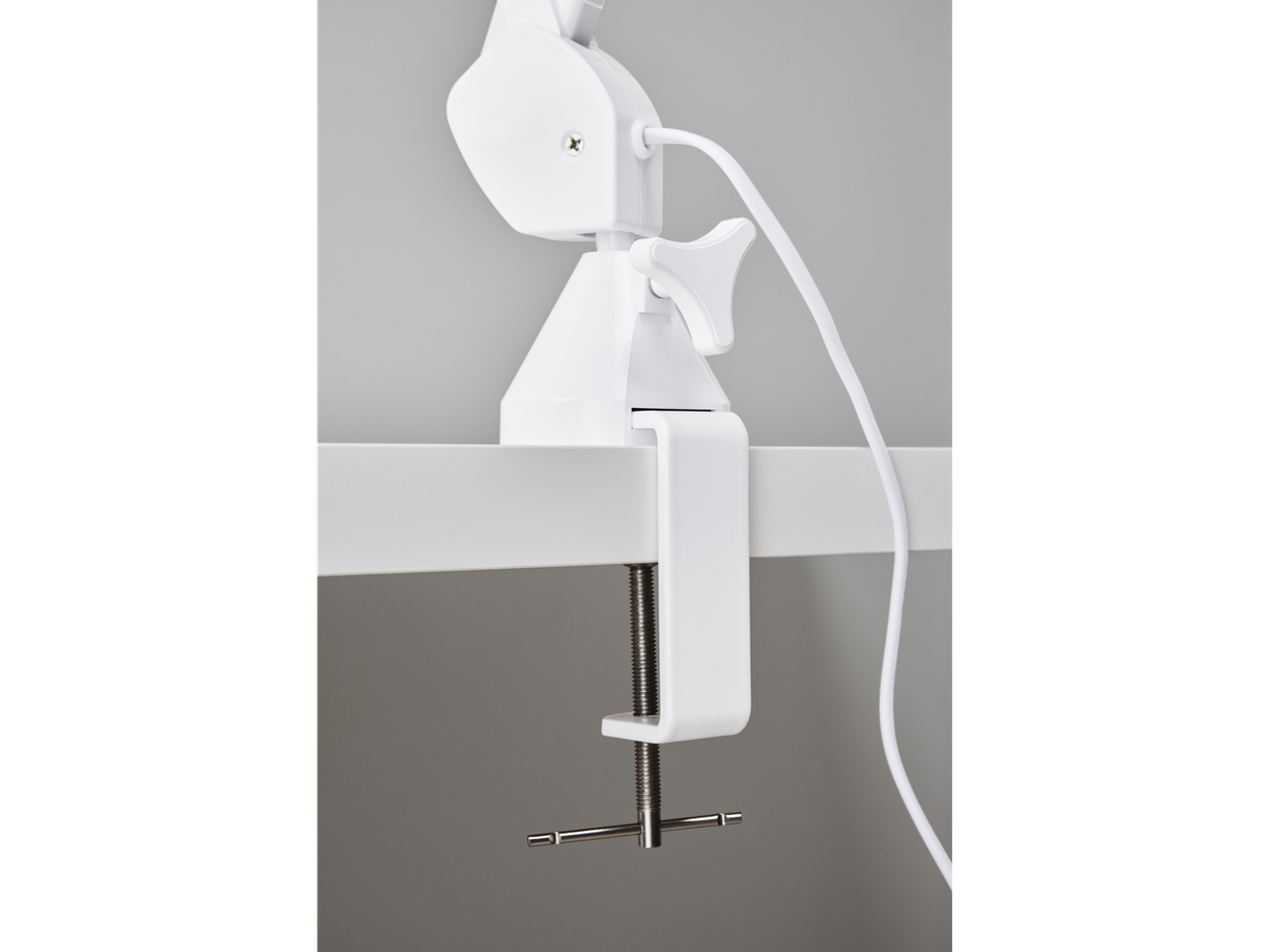 Crelando® lampa sa lupom, bela stezaljka pričvršćena za površinu.