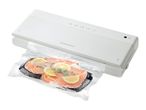 Vacuum sealer packaging salmon fillets with lemon slices