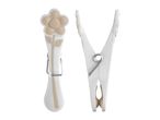 White wooden clothespins with a floral design.