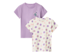 Dva dječja T-shirta: jedan ljubičasti s džepom i cvjetnim uzorkom, drugi bež s ljubičastim i ružičastim cvjetovima.