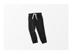 Black denim joggers with a white drawstring on a white background.