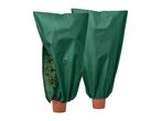 Two green plant protection covers over potted plants
