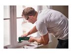 Man using a PARKSIDE oscillating multi-tool to sand a window frame.