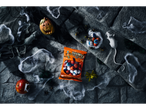 Halloween candy with chocolate eyeballs, a pumpkin, and rats in a spooky setting.