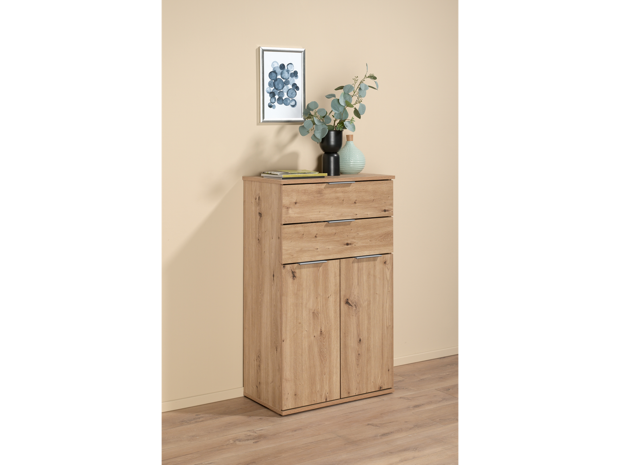 A light oak wood cabinet with two drawers and two doors.