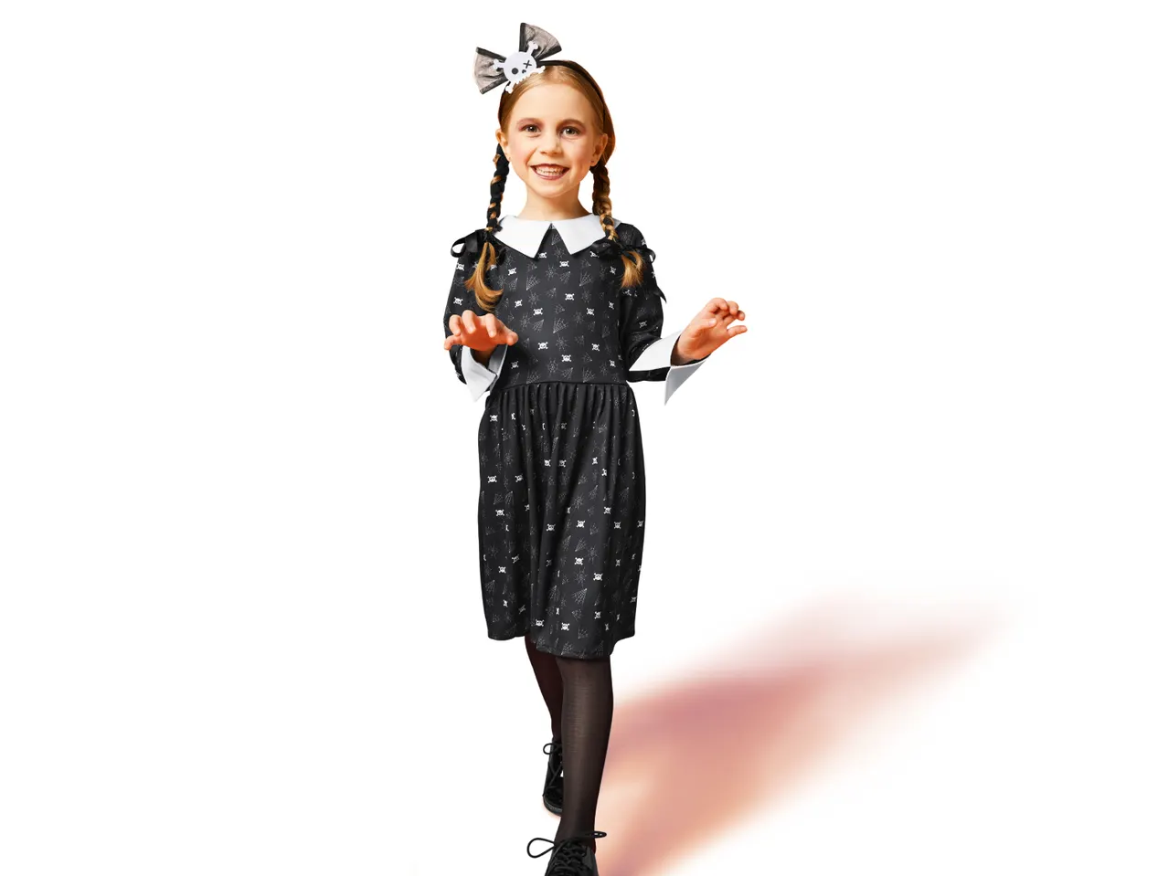 Girl in a Wednesday Addams-style costume with a skull bow and braided pigtails