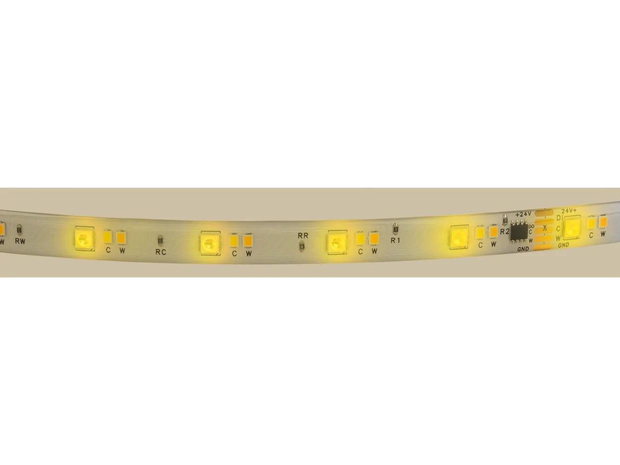 Close-up of an illuminated LED strip with color-changing LEDs and integrated circuitry.