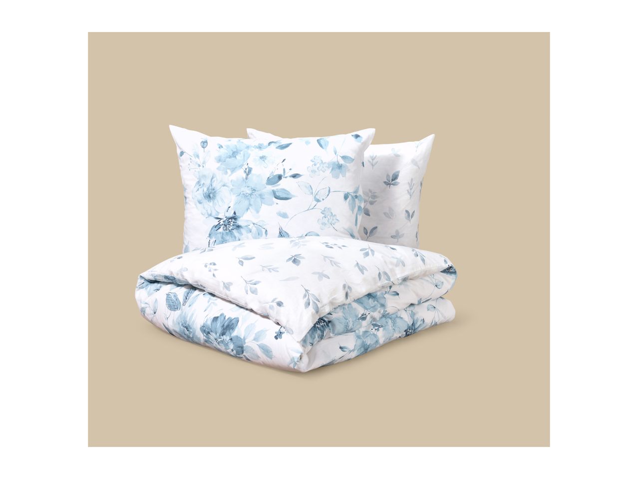White bedding set with blue floral pattern, including two pillows and a folded duvet.