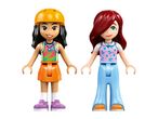 Two toy figures, one with a helmet and skirt, the other with long hair and pants.