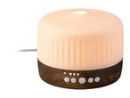 Aroma diffuser with a wooden base, glowing white cover and control buttons