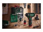 Cordless drill with various drill bits, screwdriver bits, and other tools on a wooden workbench.