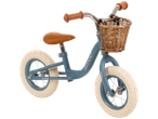 Huffy balance bike with wicker basket, vintage style.