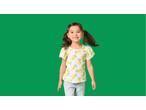 Smiling girl in a white Lupilu Kids' T-shirt with yellow lemon print and light blue jeans.