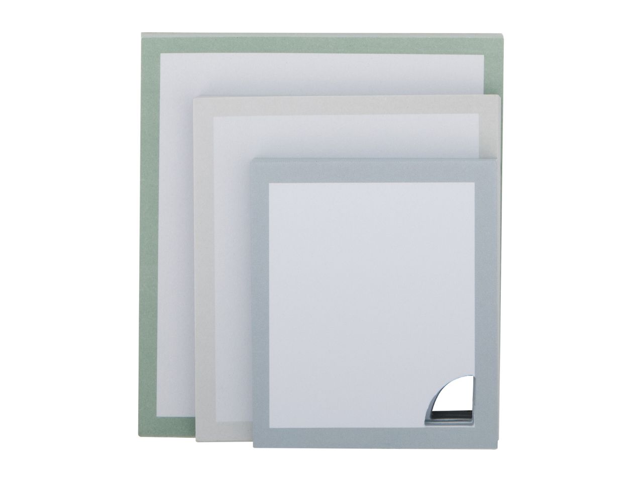 Three nested notebooks or notepads in varying shades of green and blue, with white pages.